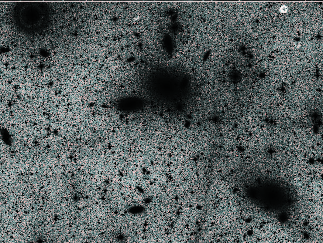 Same image but from a professional telescope (with brighter objects blacked out)