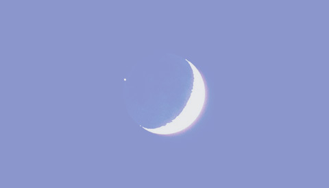 Photo-illustration of Moon occulting star in blue sky