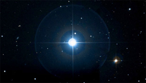 Alpha Comae Berenices, from red and blue plates of the Digitized Sky Survey.