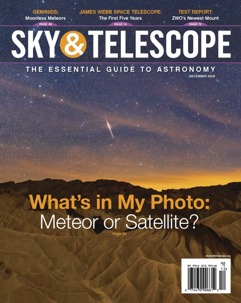 The cover of the December 2026 issue featuring a meteorite cutting across a star-filled sky above some mountains.
