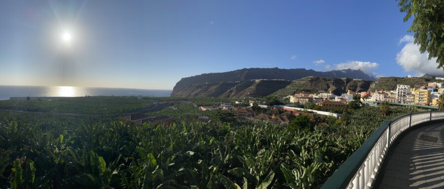 a vast landscape of green between the viewer and the ocean