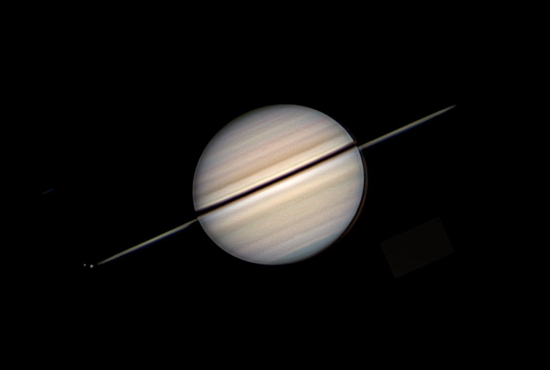 Saturn with nearly edge-on rings, and Rhea and Tethys, Nov. 29, 2025