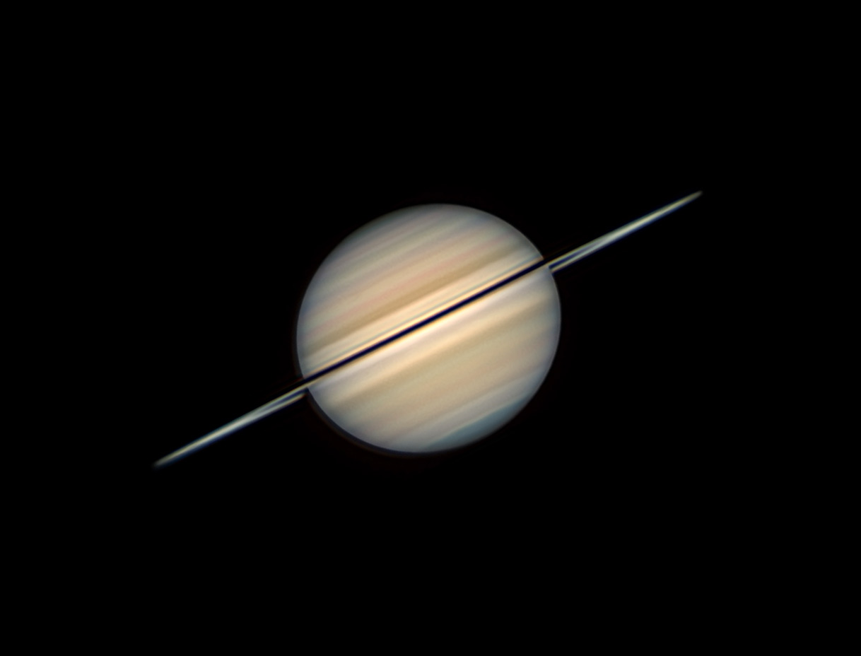 Saturn imaged by Christopher Go on October 16th, 2025, when Earth's ring-plane crossing was due in five weeks. Go uses a 14-inch telescope, a top-end planetary video camera, and state-of-the-art frame stacking and image processing, drawing on many years of experience.
