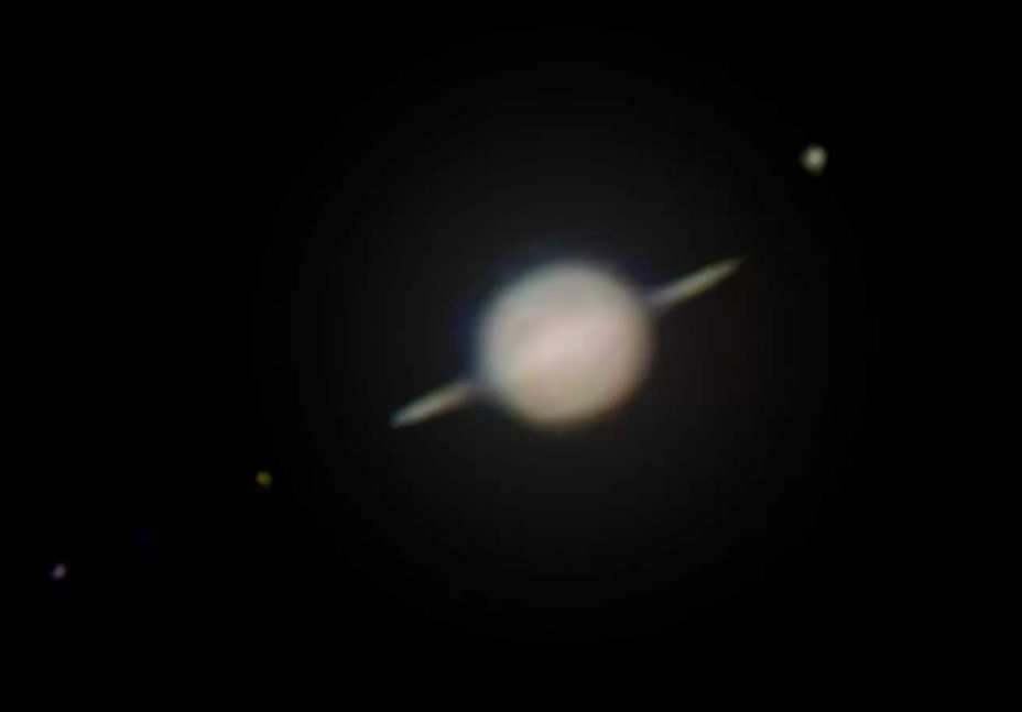 Saturn with edge-on rings and three moons imaged with a cellphone on a 70mm telescope