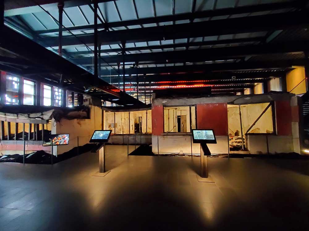 an interior view of museum displays with podiums in front of displays