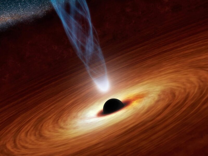 dark hole surrounded by hot disk of swirling gas and shooting out a jet from its rotation axis