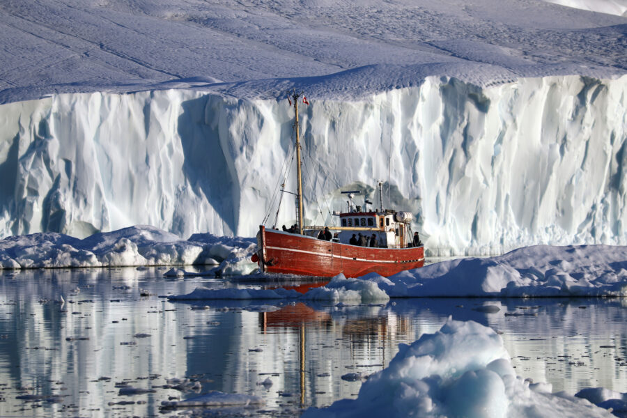 Boat with Jakobshavn Glacier