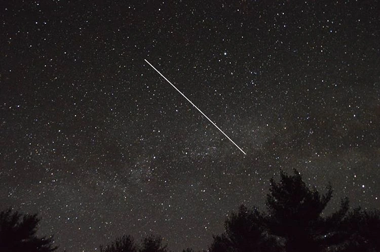 International Space Station streak across night sky in time exposure